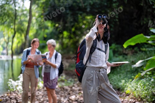 Preview: Backpack tourist travel outdoor adventure bird study using binoculars looking and record to book