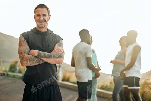 Preview: Ready to tackle the road. Shot of a young man getting ready to workout with his group of friends.