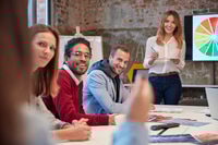 Preview: Businesswoman holding presentation at a meeting with colleagues in the office