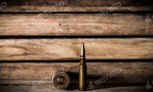 Preview: weapons, cartridge on wooden background