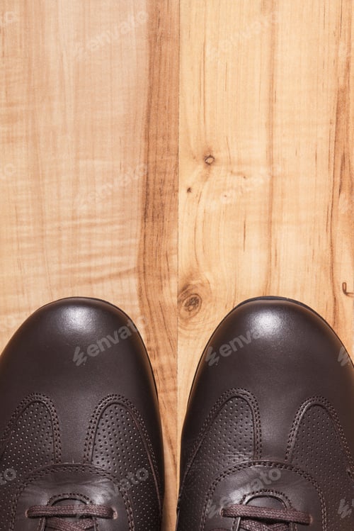 Preview: Brown shoes for men on rustic board, copy space for text