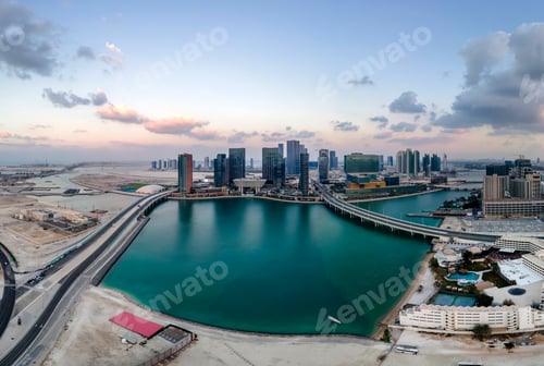 Preview: Enchanting sunset in Abu Dhabi showing Al Mariyah and Al Reem islands. Aerial wide panorama view.