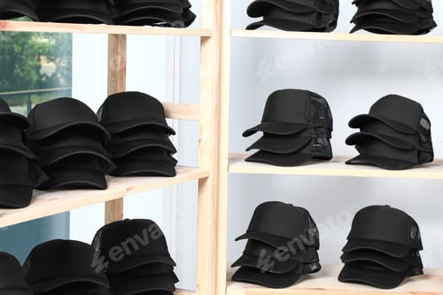 Preview: Wooden rack with blank black caps in store