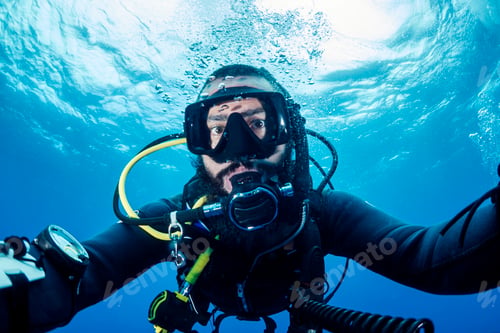 Preview: selfie portrait of a male scuba diver in wetsuit