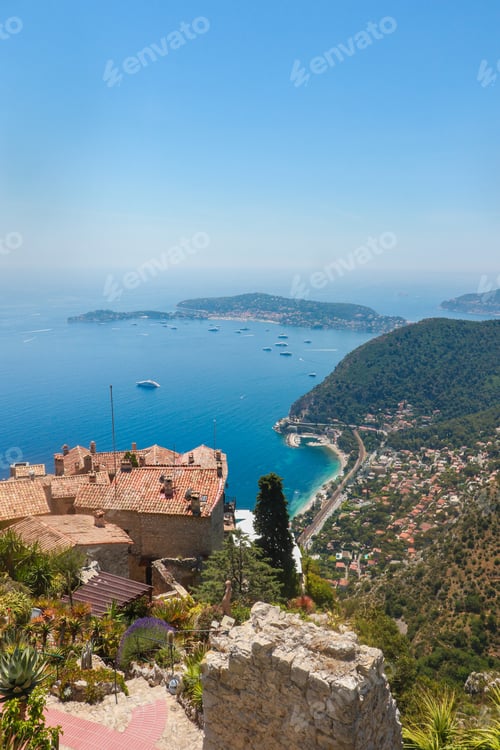 Preview: Scenic view of Eze village and green hills surrounded by blue waters. France