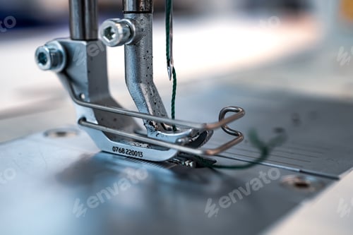 Preview: Professional sewing machine close-up. Modern textile industry.