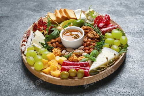Preview: Wooden platter with different tasty appetizers on grey table
