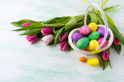 Preview: Easter star decorated glitter eggs in yellow wicker basket backg
