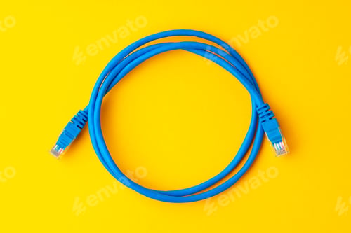 Preview: Network cable on yellow background studio shot