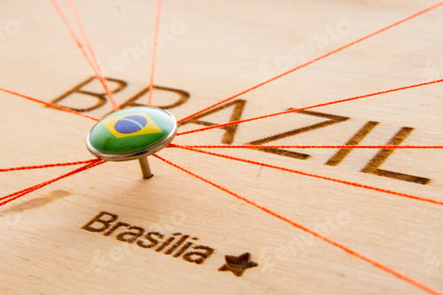 Preview: Brazil flag on the pushpin and red threads on the wooden map