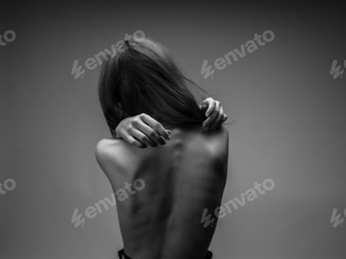 Preview: Black and white photography portrait of woman with naked back cropped view