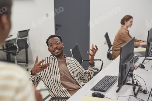 Preview: Young African American Man Working in Office