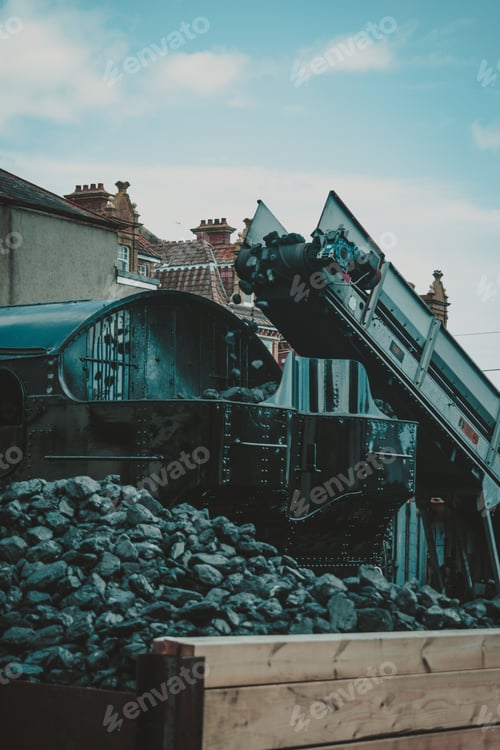 Preview: Vertical shot of the coal being loaded up into a Steam Train in Paignton, Devon UK