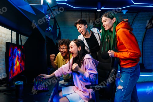 Preview: Multiethnic group of young friends playing videogames