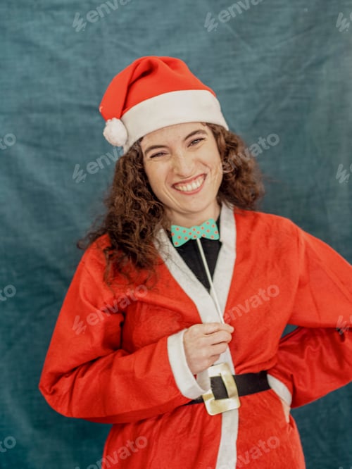 Preview: Woman wearing santa claus costume making funny face