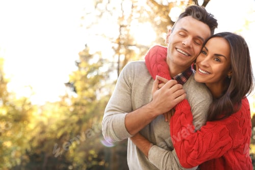 Preview: Happy couple in sunny park. Autumn walk