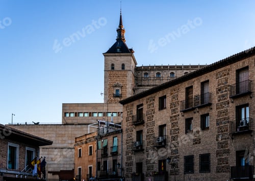Preview: The majestic Alcazar of Toledo stands tall against a clear blue sky.