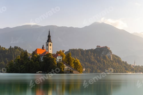 Preview: Nature scenery from Julien Alps with peak in background and church near water