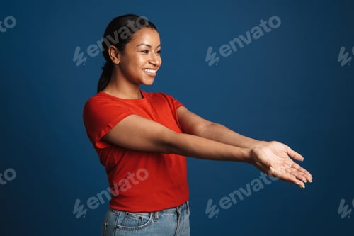 Preview: Young black woman smiling and reaching out her hands aside
