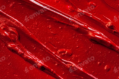 Preview: Red lipstick background texture smudged. Close up
