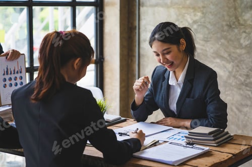 Preview: Business meeting concept brainstorming financial analyst financial report on graph document during c
