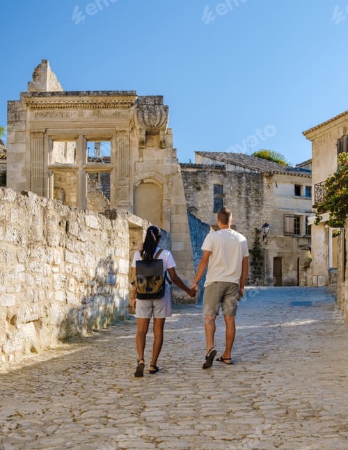Preview: a couple on vacation in the Provence France walking at the streets of the French village Les Baux