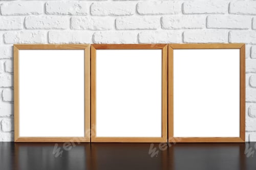 Preview: Blank picture frame against brick wall with copy space