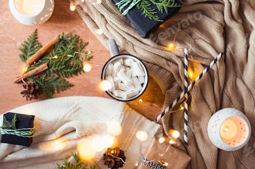 Preview: Christmas still life with coffee cup cozy plaid and candle lights
