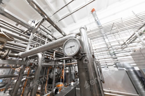 Preview: Industrial zone background concept. Steel pipelines and cables in manufacture interior
