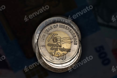 Preview: Closeup of Indian Rupee coin on a stack of a world coins