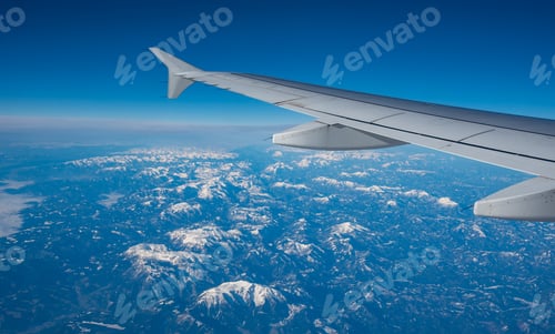 Preview: Plane wing in a flight and dramatic cloudscape white clouds over europe