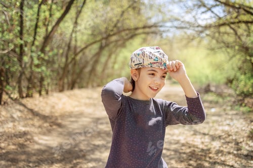 Preview: Portrait of cheerful laughing girl in spring park