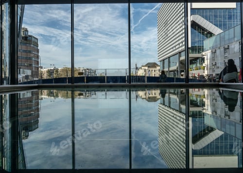 Preview: Wide angle shot of several urban buildings under a clear blue sky