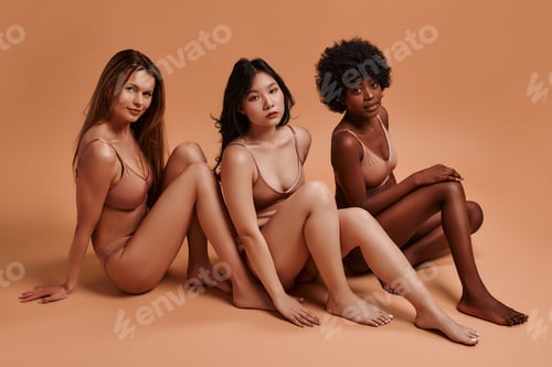 Preview: Multiethnic women on beige background