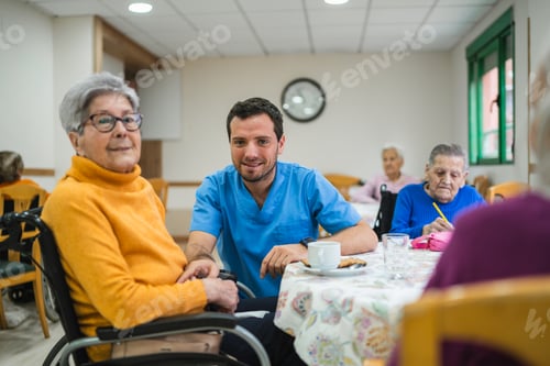 Preview: Caregiver assisting senior woman in nursing home