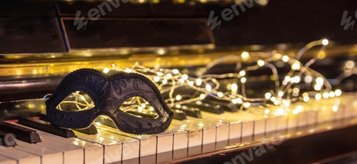 Preview: Carnival Piano music, black mask and bokeh lights background.