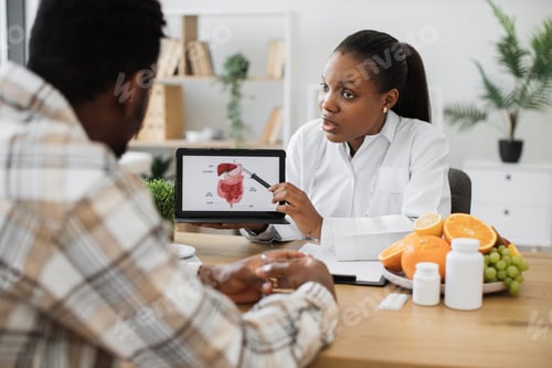 Preview: Woman holding tablet with GI tract while counseling client
