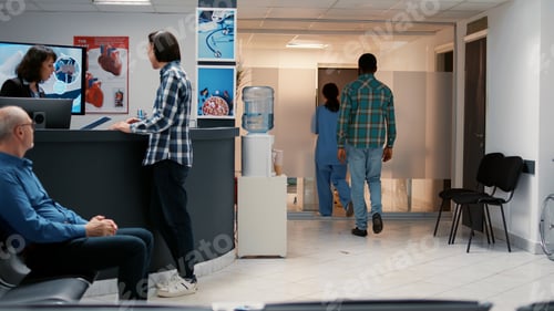 Preview: Medical assistant asking african american man to attend consultation