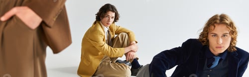 Preview: Stylish young friends explore modern fashion together in a creative urban setting