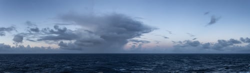 Preview: Dramatic Dark and Moody Sunrise Sky over North Atlantic Ocean. Cloudscape Nature Background.