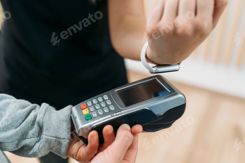 Preview: Customer paying with smartwatch in a retail store