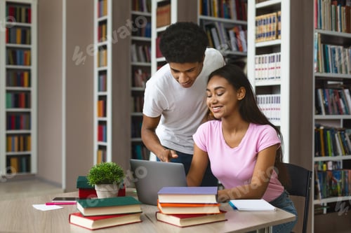 Preview: African american guy offering support to black girl in library