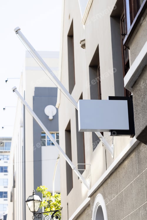 Preview: Blank sign fixed to building wall with copy space