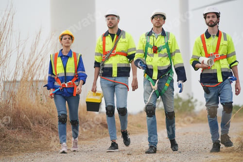 Preview: Sustainable energy industry - Engineers working at alternative renewable wind energy farm