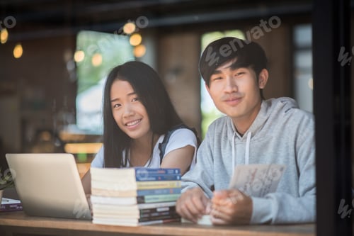 Preview: Group of happy friends student talking about knowledge in cafe