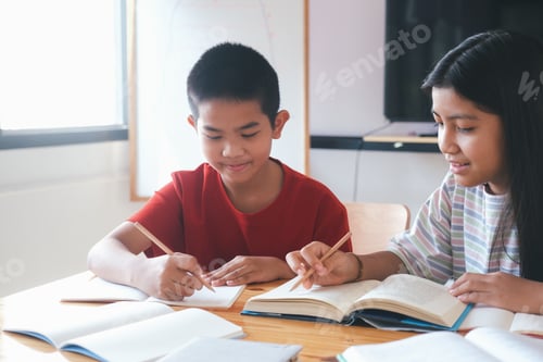 Preview: asian primary school students studying in classroom.