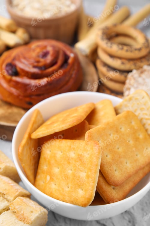 Preview: Different gluten free products on light grey textured table, closeup