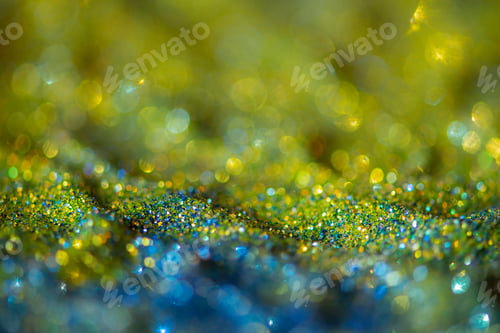 Preview: Abstract glitter lights colorful bokeh background in blue and yellow color tones