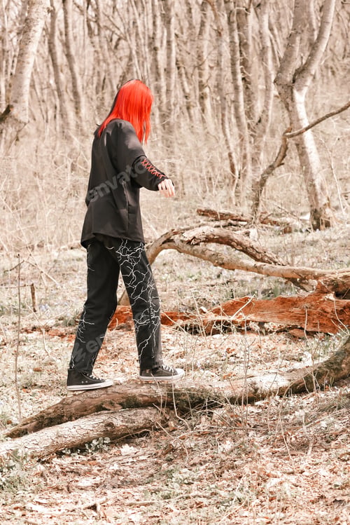 Preview: A young girl with colored hair walks in the park