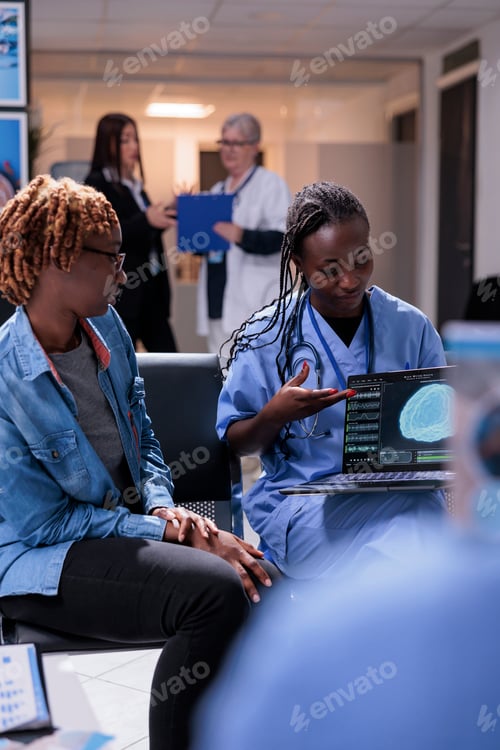 Preview: Nurse and patient analyzing brain scan